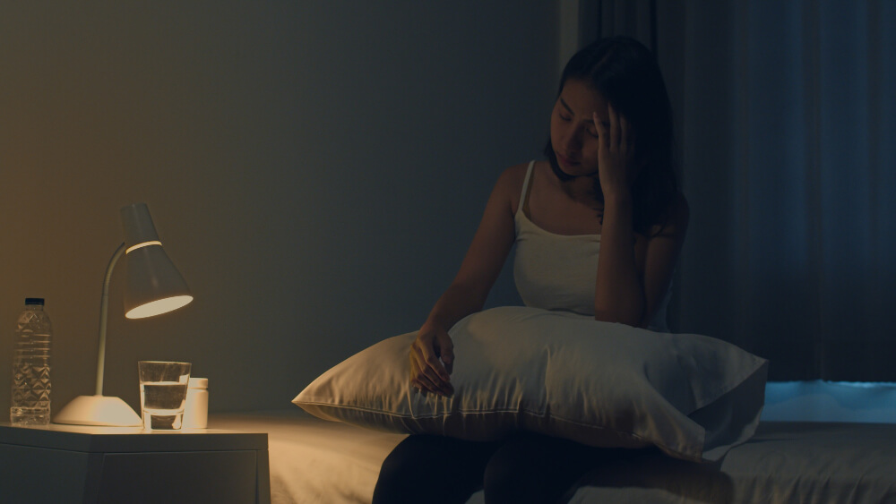 Woman Suffering From Causes of insomnia including stress and sleep disruption Woman Suffering From Causes of insomnia including stress and sleep disruption