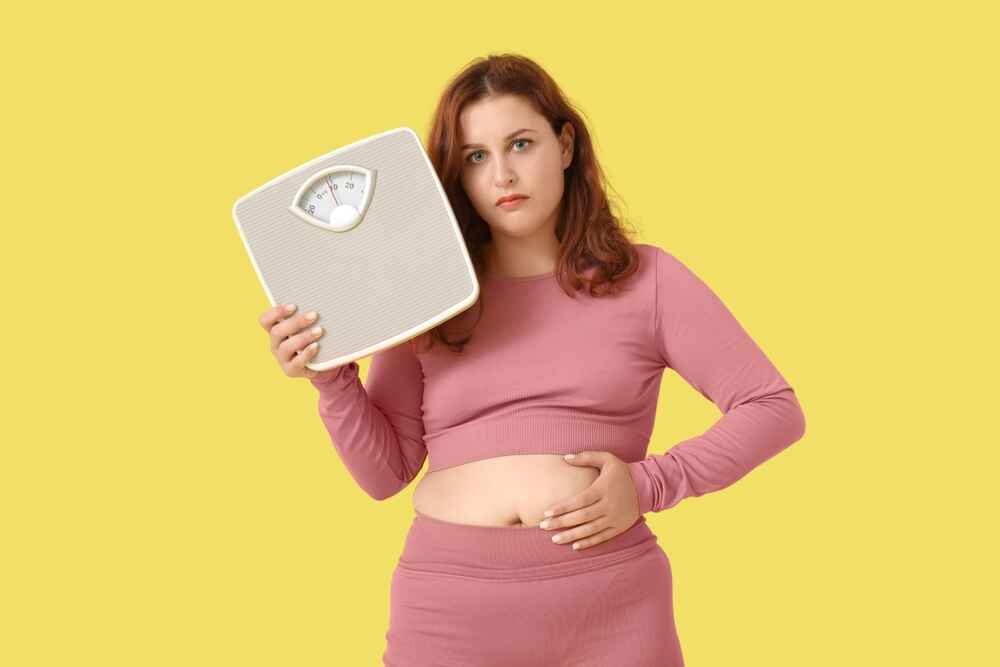 Woman Sad About Her Weight Gain