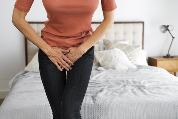 Woman experiencing symptoms of a urinary tract infection